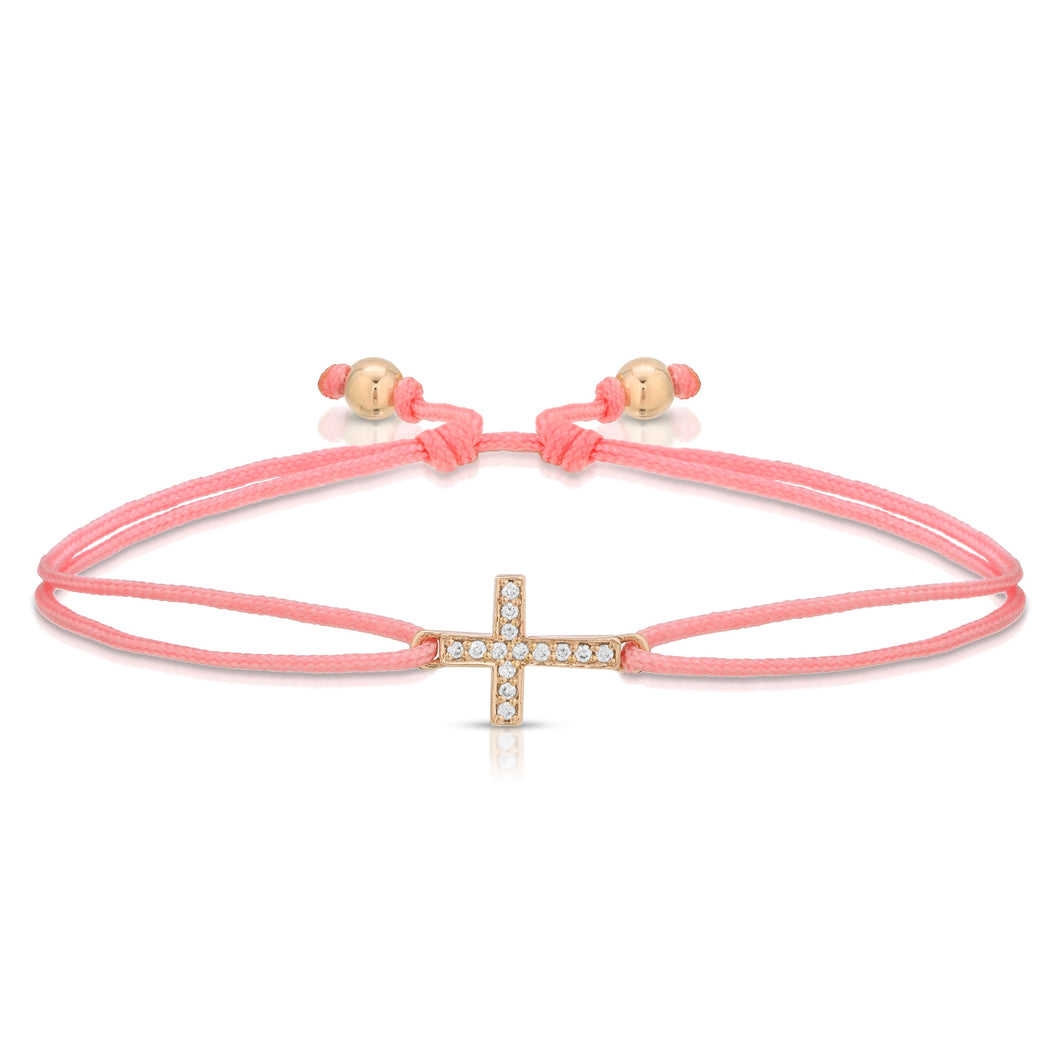 “Petite Croix” 14-karat gold cross with diamonds on silk cord bracelet