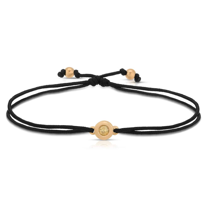 “Cecily” 14-karat gold donut with diamond on silk cord bracelet